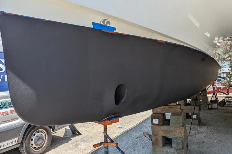 Slide: The Image of 2020 Fountaine Pajot MY 37 yacht hull on dry dock, undergoing maintenance. - 25