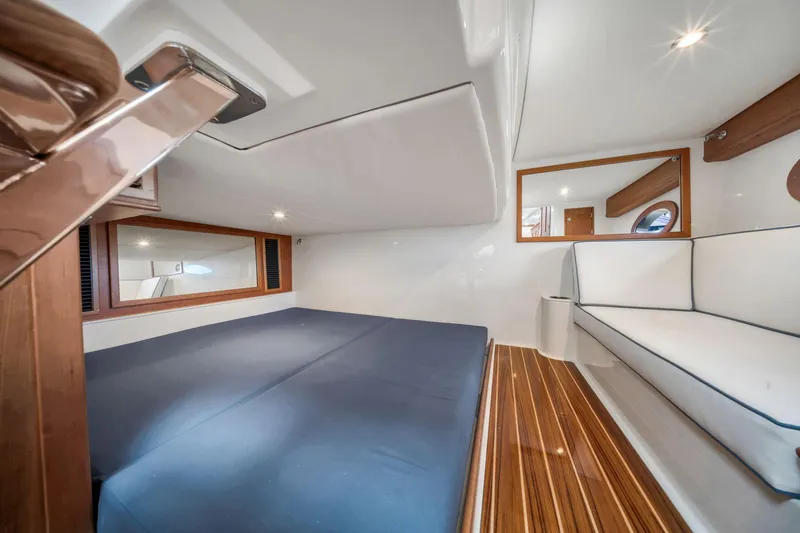 Slide: The Image of Luxurious interior of 2025 Hinckley Sport Boat 40 X with elegant wood flooring. - 10