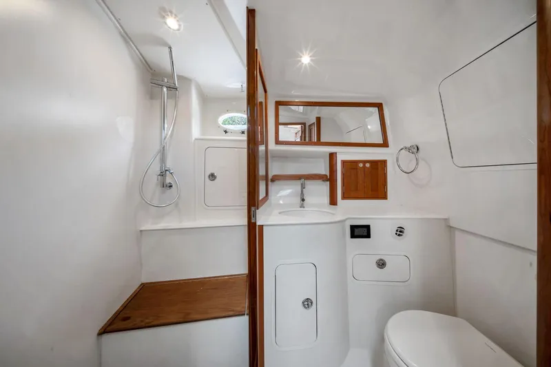 Slide: The Image of Luxurious bathroom interior of 2025 Hinckley Sport Boat 40 X with modern fixtures. - 12
