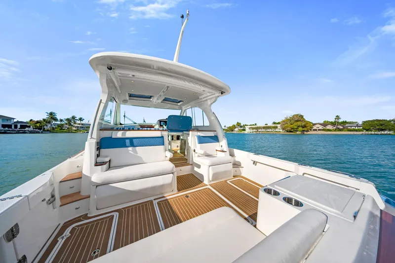 Slide: The Image of 2025 Hinckley Sport Boat 40 X on water, featuring spacious deck and modern design. - 3