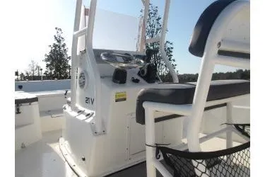 Slide: The Image of 2018 H20 Sports MFG 21 V/CC boat console with seating and controls. - 11