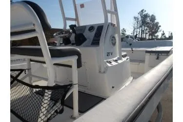 Slide: The Image of 2018 H20 Sports MFG 21 V/CC boat interior with console and seating. - 12