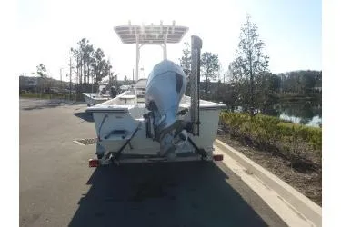 Slide: The Image of 2018 H20 Sports MFG 21 V/CC boat, rear view, parked on a sunny day. - 6