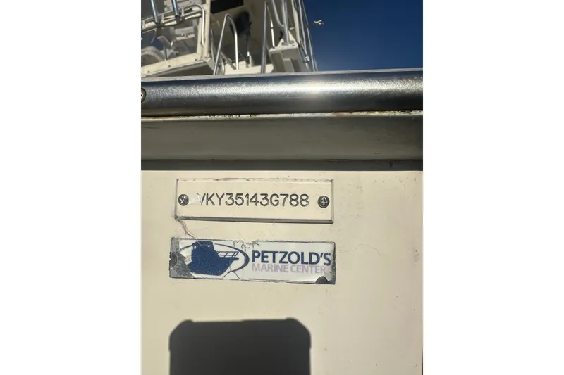 Slide: The Image of 1988 Viking 35 Convertible boat interior with seating and storage compartment. - 10