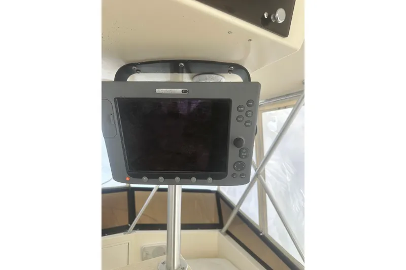 Slide: The Image of 1988 Viking 35 Convertible boat cockpit with navigation display. - 16