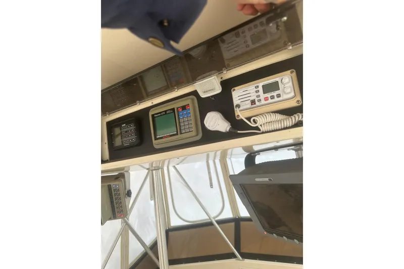 Slide: The Image of Control panel of a 1988 Viking 35 Convertible boat with navigation equipment. - 17