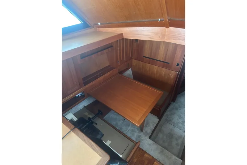 Slide: The Image of 1988 Viking 35 Convertible interior with wooden cabinetry and table. - 27