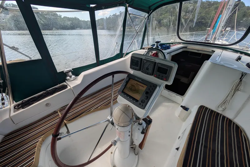 Slide: The Image of 2006 Beneteau Oceanis Clipper 373 cockpit with navigation equipment and steering wheel. - 12