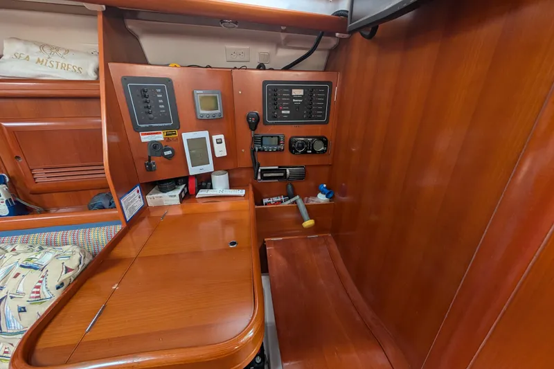 Slide: The Image of Interior of 2006 Beneteau Oceanis Clipper 373 yacht with navigation equipment and wooden finish. - 18