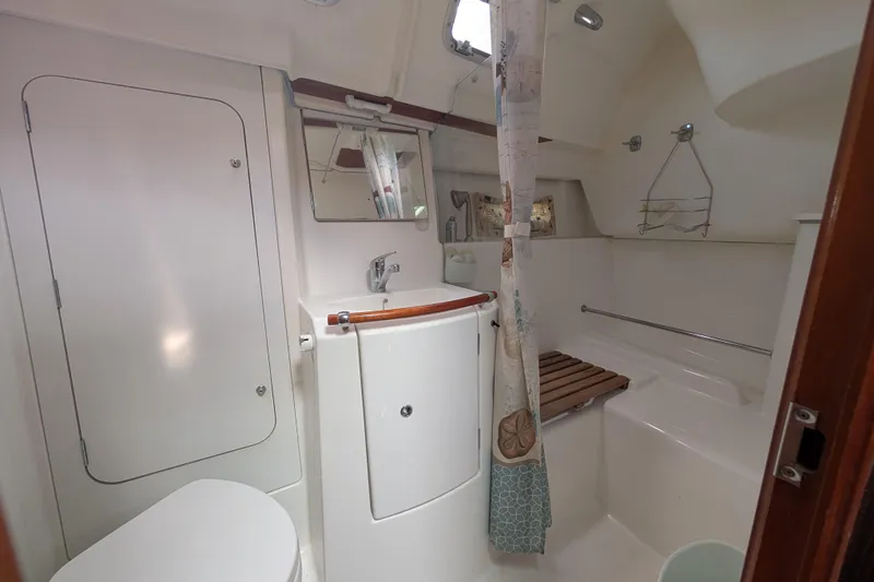Slide: The Image of Bathroom of 2006 Beneteau Oceanis Clipper 373 yacht, featuring shower and toilet. - 19