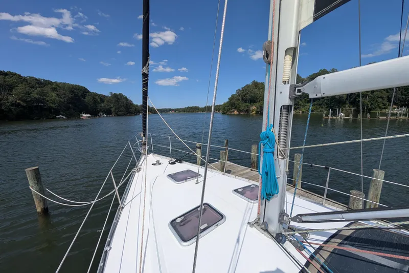 Slide: The Image of Sailing on a 2006 Beneteau Oceanis Clipper 373 in a serene river setting. - 7