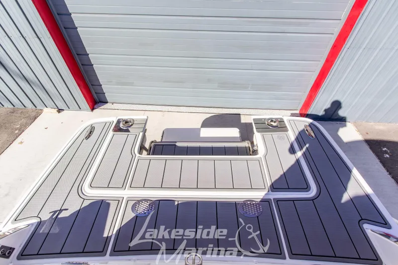 Slide: The Image of 2021 Chaparral 267 SSX boat deck at Lakeside Marina, featuring sleek gray design. - 12