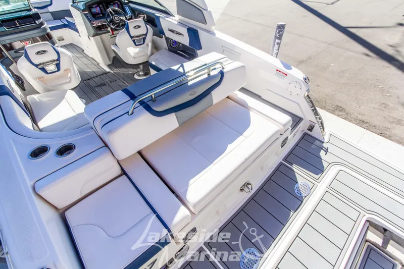 Slide: The Image of 2021 Chaparral 267 SSX boat interior with luxurious seating and modern dashboard. - 15