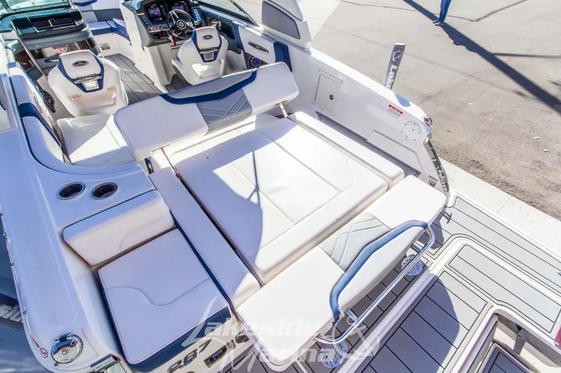 Slide: The Image of 2021 Chaparral 267 SSX boat interior with luxurious seating and modern dashboard. - 16