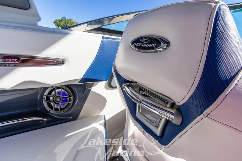 Slide: The Image of 2021 Chaparral 267 SSX boat interior with speaker and logo detail. - 23