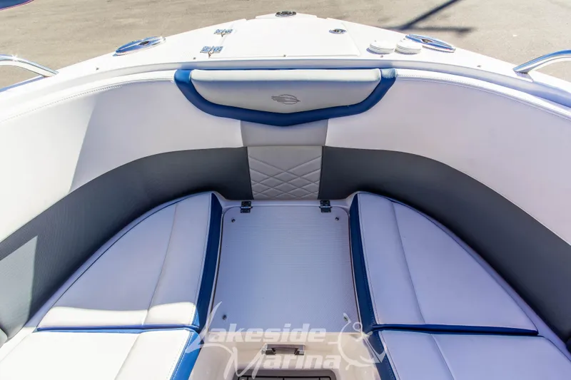 Slide: The Image of Interior of 2021 Chaparral 267 SSX boat with white and blue seating. - 38