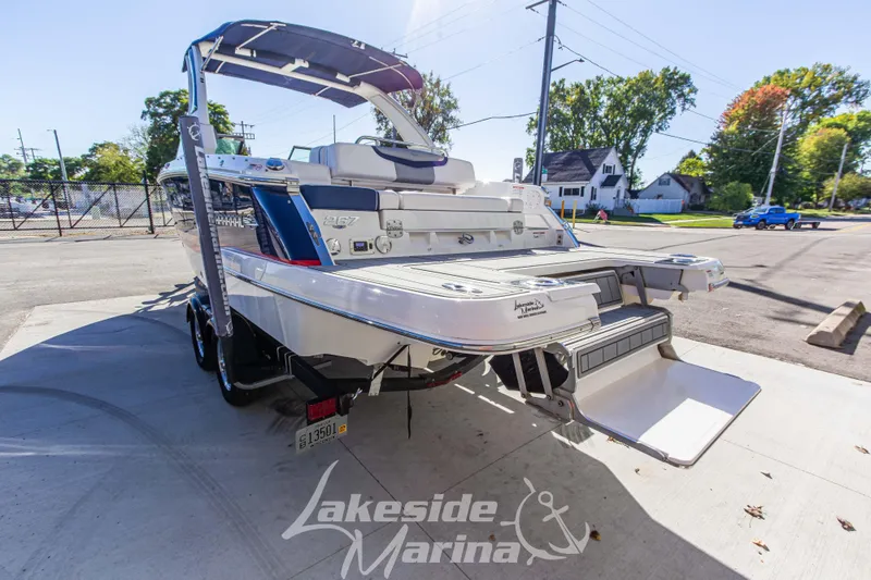 Slide: The Image of 2021 Chaparral 267 SSX boat at Lakeside Marina, rear view with swim platform. - 8