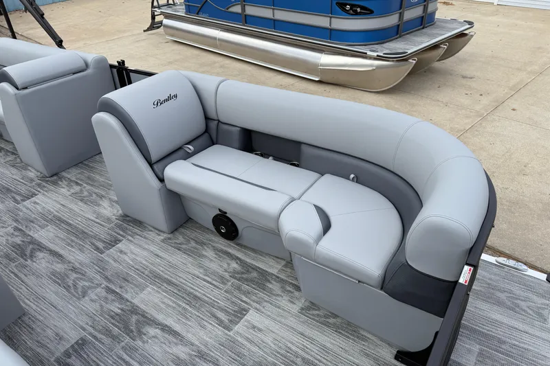 Slide: The Image of 2026 Bentley Pontoons Legacy 220 Cruise XL with luxurious gray seating and modern design. - 11