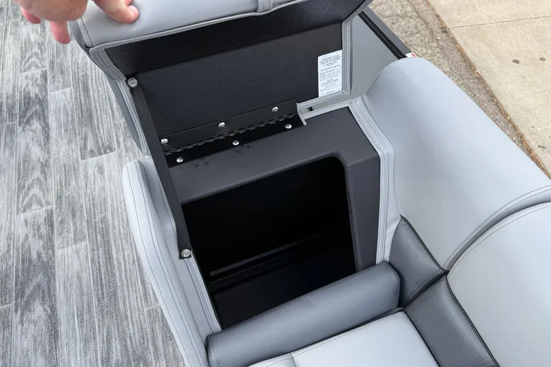 Slide: The Image of 2026 Bentley Pontoons Legacy 220 Cruise XL seat storage compartment open. - 14