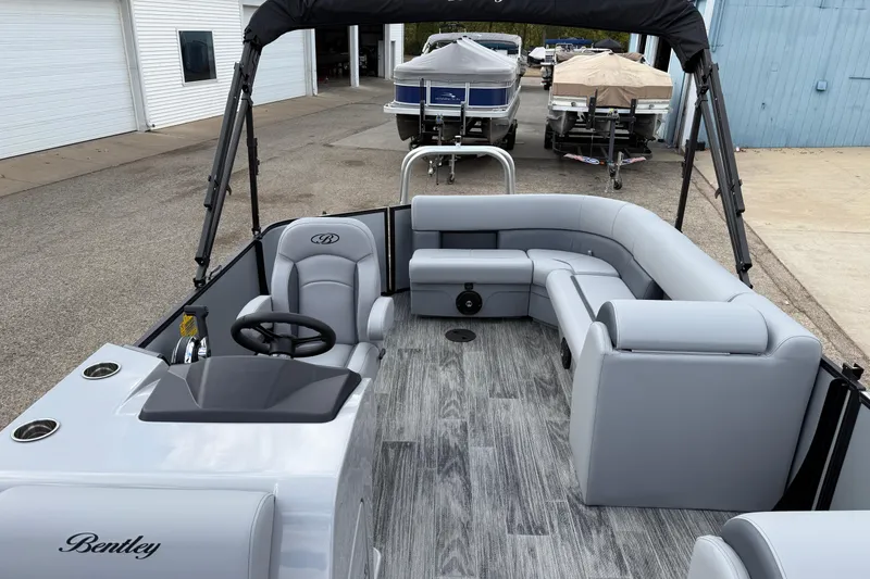 Slide: The Image of 2026 Bentley Pontoons Legacy 220 Cruise XL with sleek gray interior and modern design. - 15