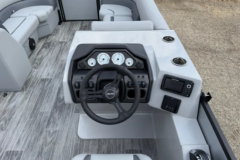 Slide: The Image of 2026 Bentley Pontoons Legacy 220 Cruise XL dashboard with steering wheel and gauges. - 17