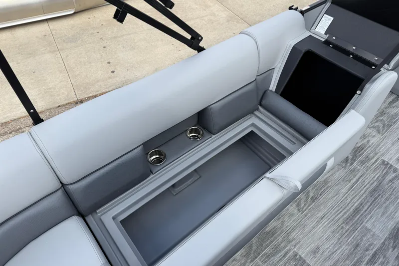 Slide: The Image of 2026 Bentley Pontoons Legacy 220 Cruise XL interior seating with cup holders and storage. - 20
