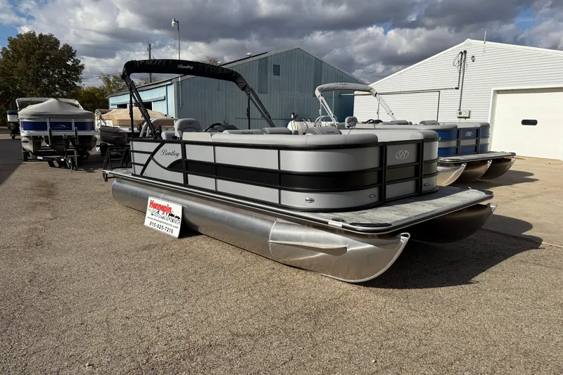 Slide: The Image of 2026 Bentley Pontoons Legacy 220 Cruise XL displayed outdoors on a sunny day. - 3