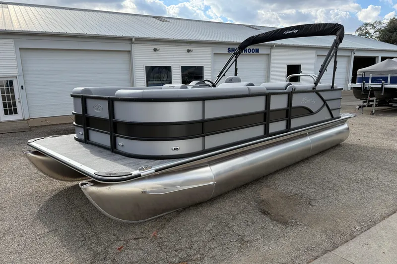 Slide: The Image of 2026 Bentley Pontoons Legacy 220 Cruise XL pontoon boat in showroom exterior. - 8