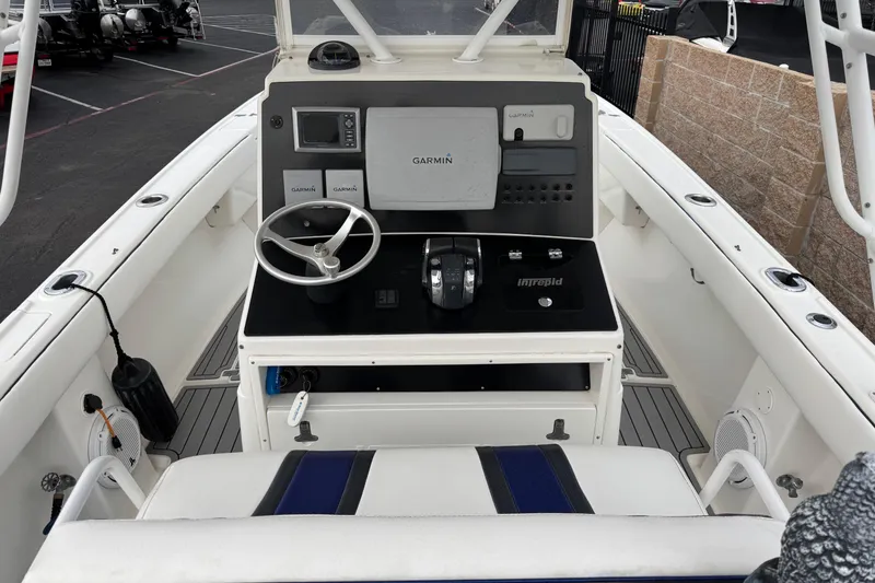 Slide: The Image of 2001 Intrepid 327 Center Console boat dashboard with Garmin navigation system. - 6