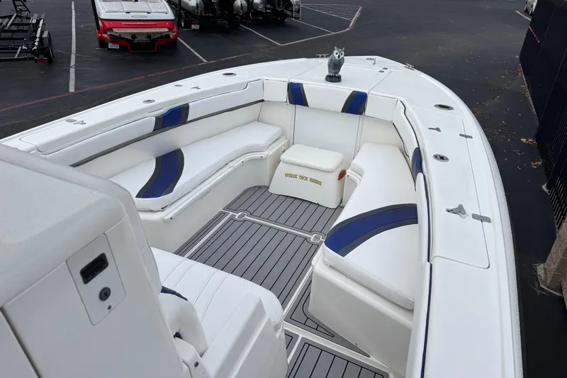 Slide: The Image of 2001 Intrepid 327 Center Console boat with spacious seating and sleek design. - 7