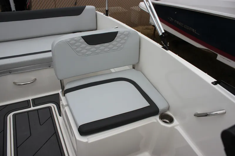 Slide: The Image of 2023 Bayliner Element M19 boat interior with modern seating and windshield. - 12
