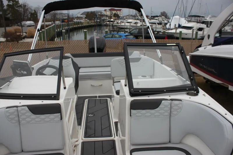 Slide: The Image of 2023 Bayliner Element M19 dashboard with steering wheel and audio controls. - 15