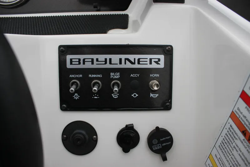 Slide: The Image of 2023 Bayliner Element M19 boat interior seating with modern design and comfortable upholstery. - 17
