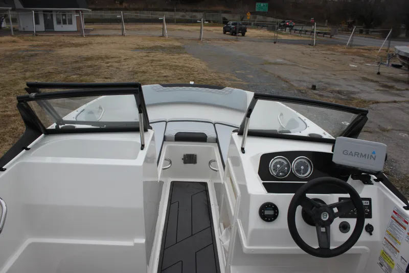 Slide: The Image of 2023 Bayliner Element M19 boat on trailer, parked outdoors. - 3