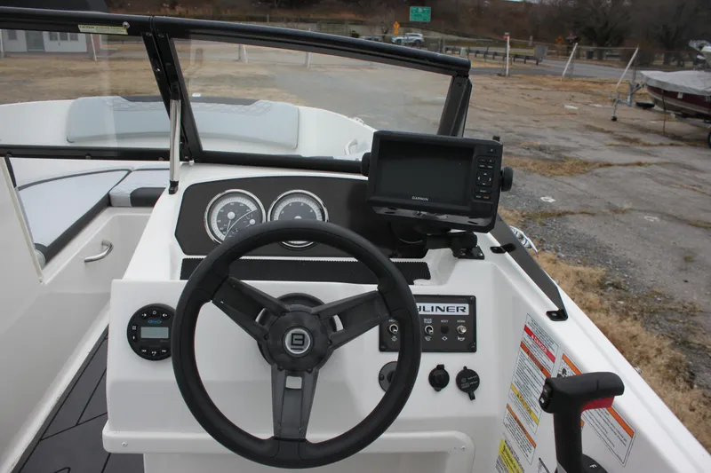 Slide: The Image of 2023 Bayliner Element M19 boat interior with sleek design and modern dashboard. - 7