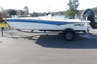 Slide: The Image of 2019 Mako Pro Skiff 17 CC boat on trailer, parked outdoors. - 1