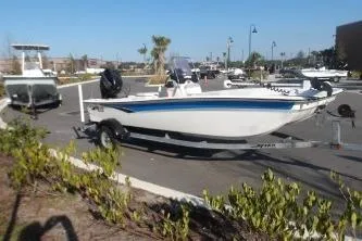 Slide: The Image of 2019 Mako Pro Skiff 17 CC boat on trailer in parking lot. - 5
