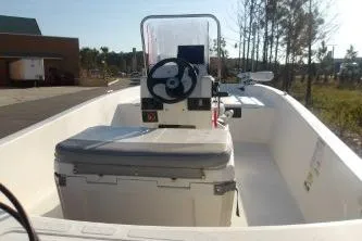 Slide: The Image of 2019 Mako Pro Skiff 17 CC boat interior with steering console and seating. - 6