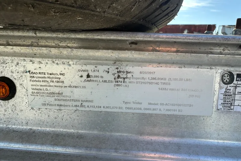 Slide: The Image of Label on Load Rite trailer, detailing specifications and manufacturing information. - 11