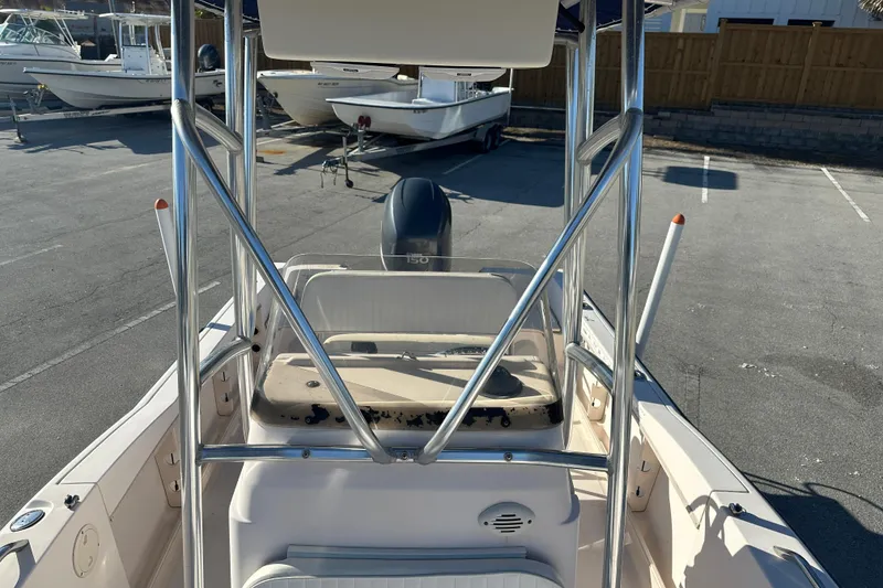 Slide: The Image of 2004 Grady-White Sportsman 180 boat with Yamaha 150 engine, parked in a marina. - 18