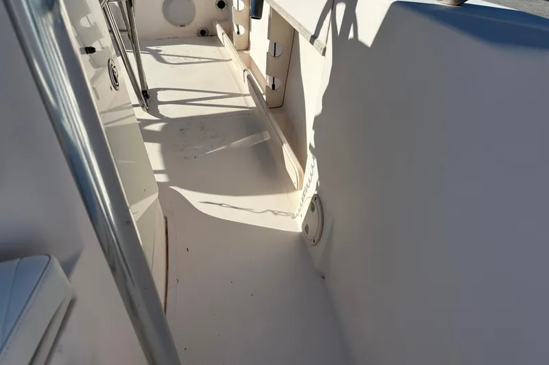 Slide: The Image of 2004 Grady-White Sportsman 180 boat interior, showcasing clean deck and seating area. - 19