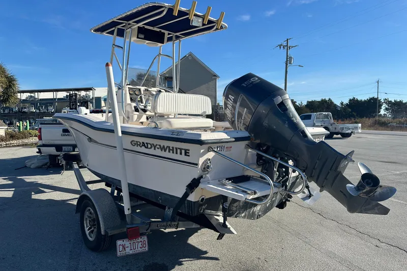 Slide: The Image of 2004 Grady-White Sportsman 180 boat on trailer with Yamaha outboard motor. - 2