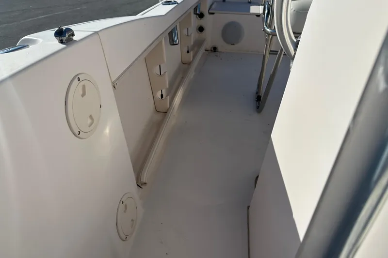 Slide: The Image of 2004 Grady-White Sportsman 180 boat interior, showcasing seating and storage compartments. - 21