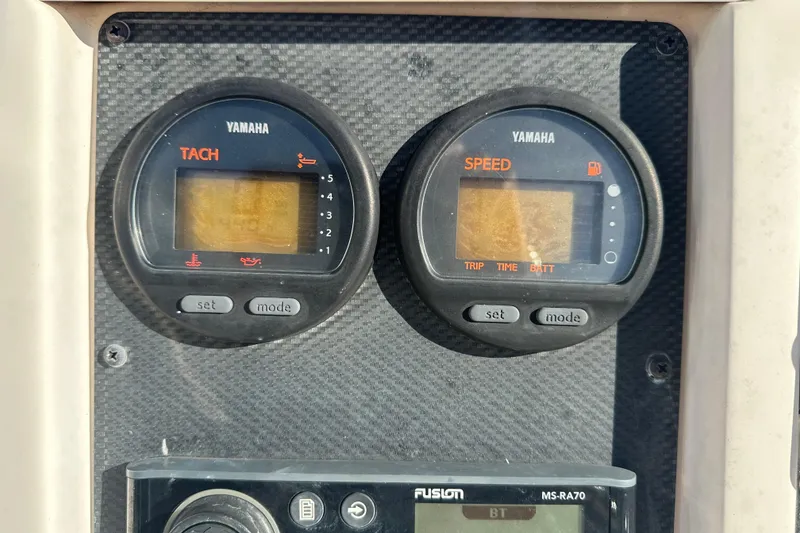 Slide: The Image of Dashboard of a 2004 Grady-White Sportsman 180 with Yamaha tachometer and speedometer. - 23