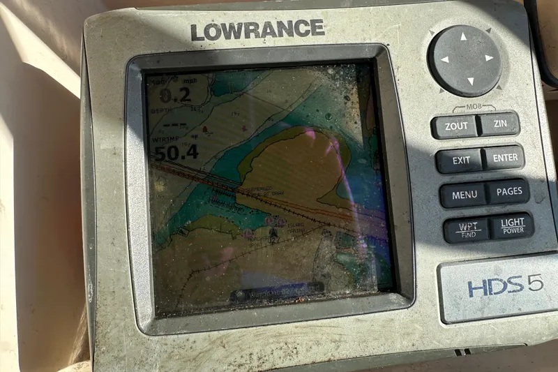 Slide: The Image of Lowrance HDS5 marine GPS on 2004 Grady-White Sportsman 180 boat, displaying navigational map. - 27