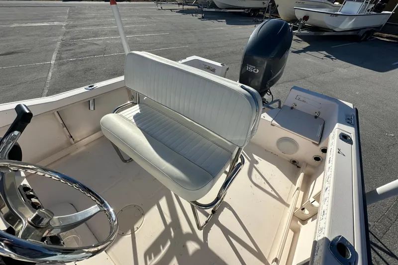 Slide: The Image of 2004 Grady-White Sportsman 180 boat interior with steering wheel and seating. - 29