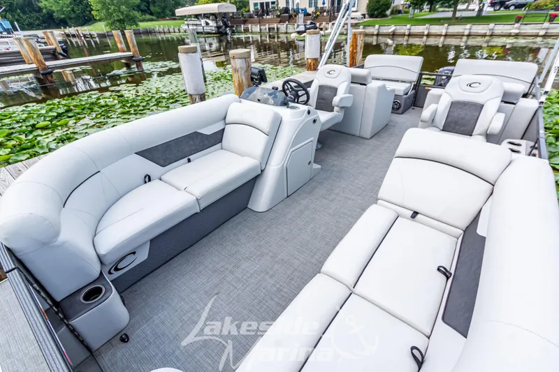 Slide: The Image of 2021 Crest Classic LX 220 SLRC pontoon boat with spacious seating and modern design. - 14