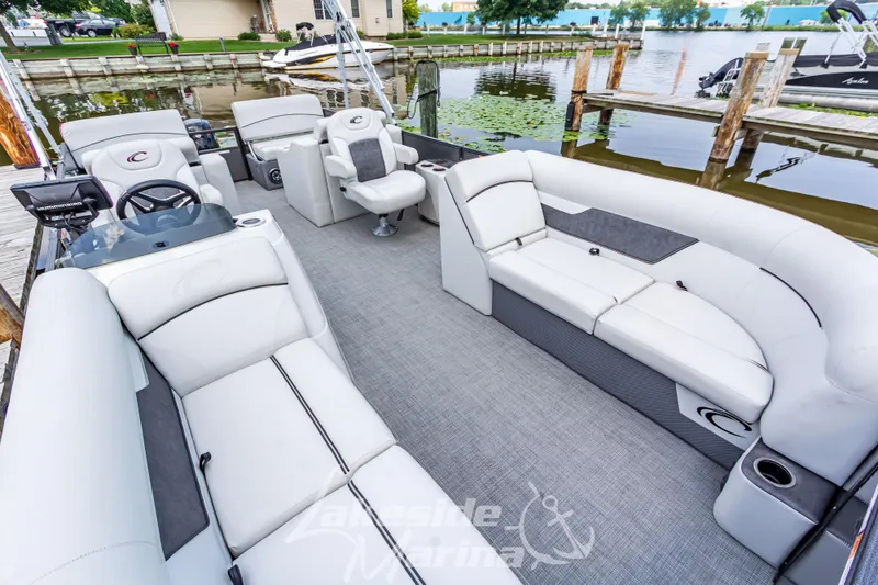 Slide: The Image of 2021 Crest Classic LX 220 SLRC pontoon boat with spacious seating and modern design. - 15