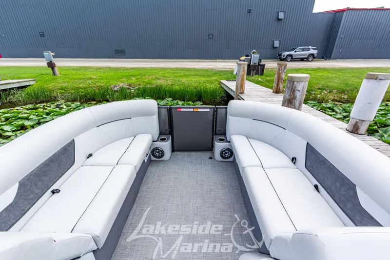 Slide: The Image of 2021 Crest Classic LX 220 SLRC pontoon boat interior with white seating at Lakeside Marina. - 16