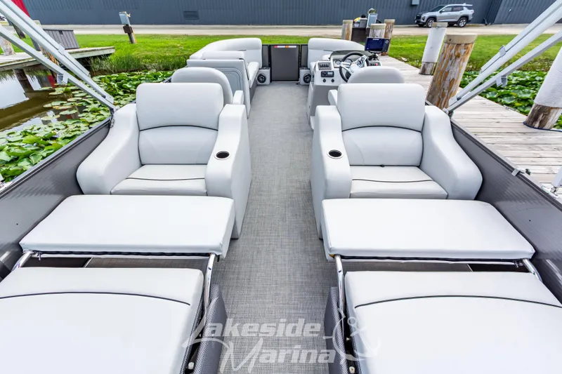 Slide: The Image of 2021 Crest Classic LX 220 SLRC pontoon boat interior with luxurious seating and modern design. - 30